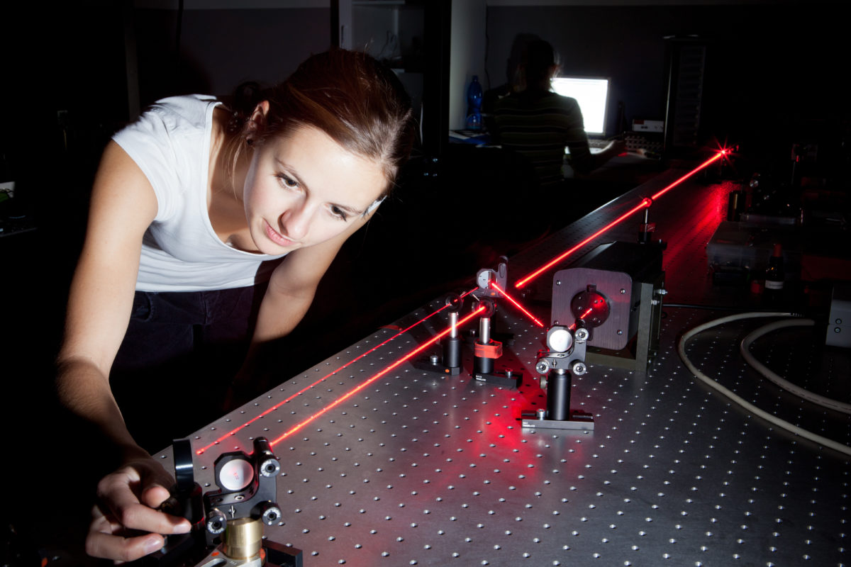 female scientist doing research in a quantum optics lab