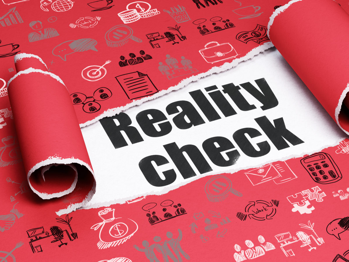 Finance concept: black text Reality Check under the piece of torn paper