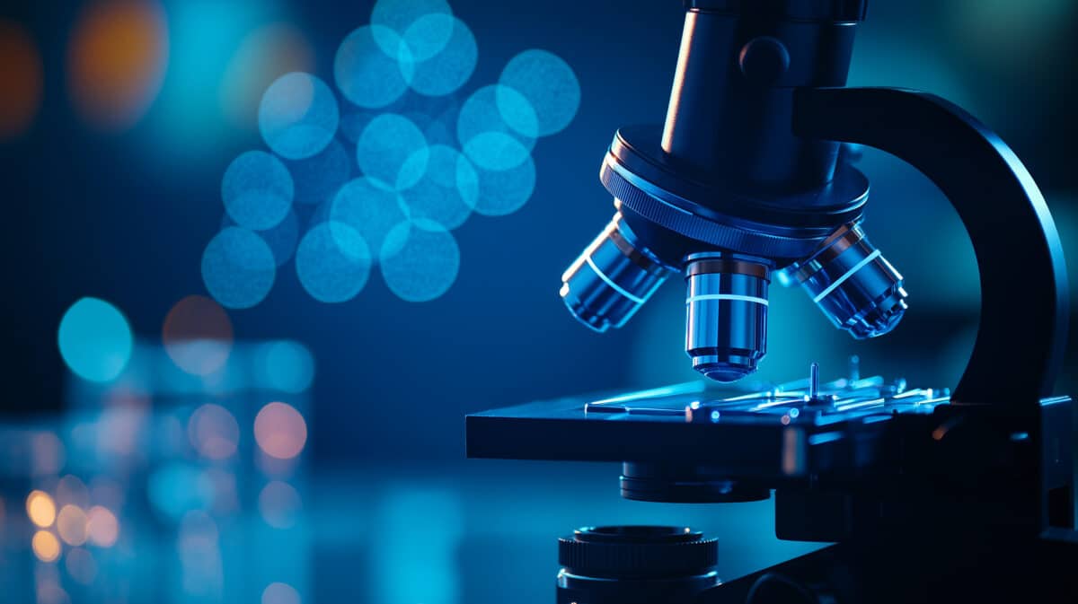 modern microscope in lab, illuminated by blue light, showcases intricate details and advanced technology, creating captivating scientific atmosphere