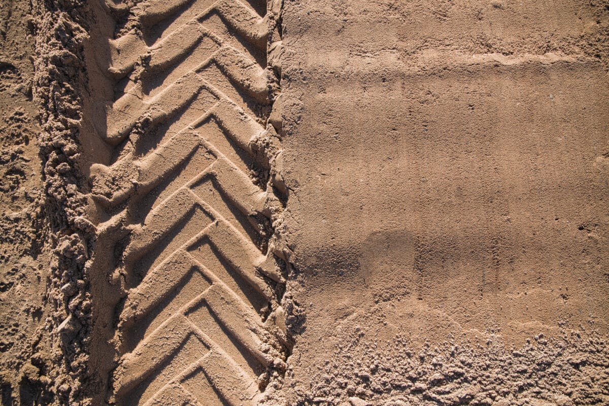 sand with tractor wheel tread on it