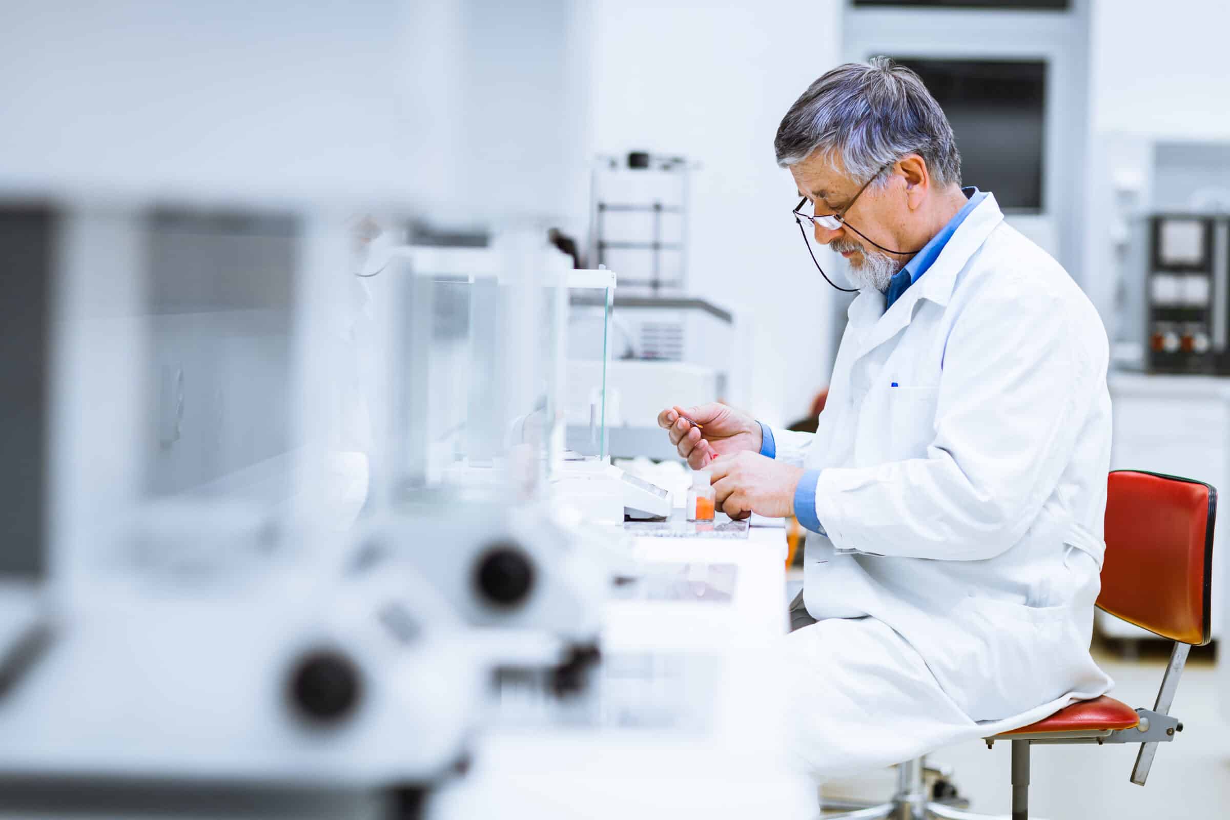 Senior male researcher carrying out scientific research in a lab