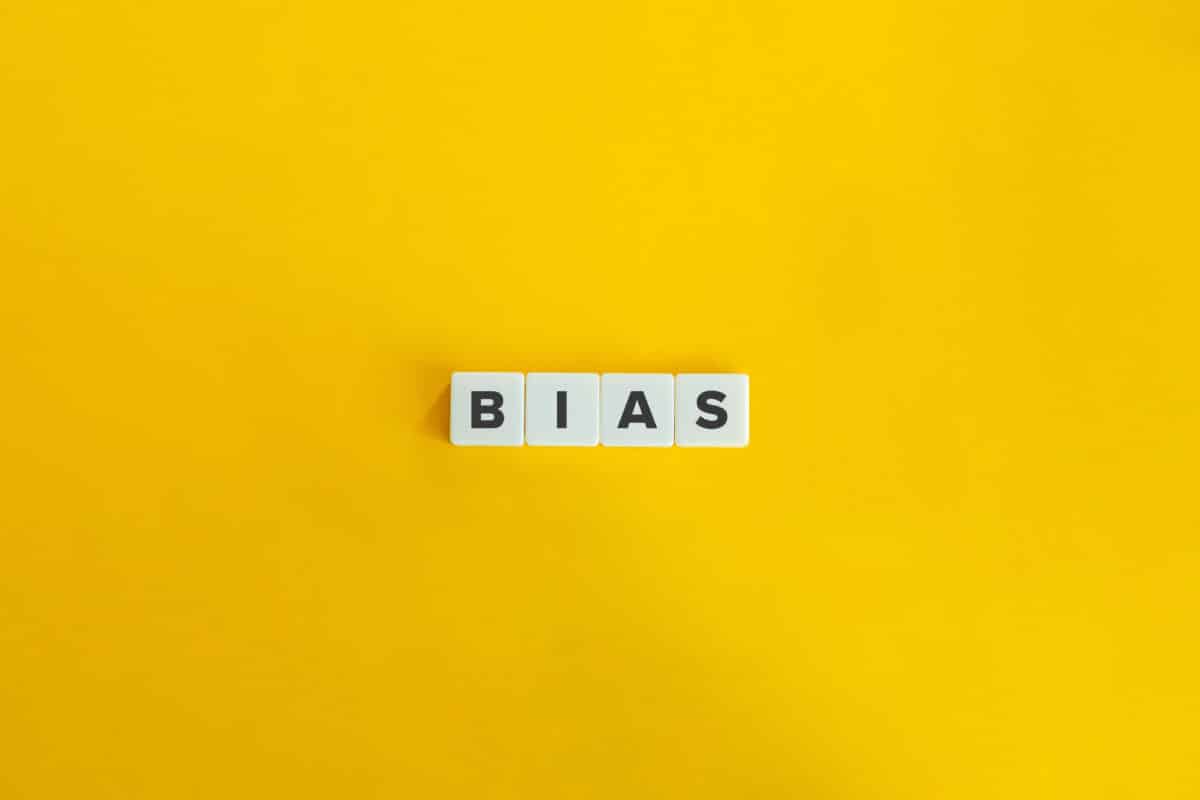 Bias Word on Letter Tiles on Yellow Background. Minimal Aesthetics.