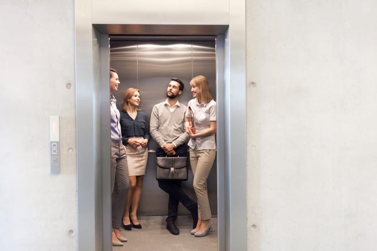 Business people waiting in elevator